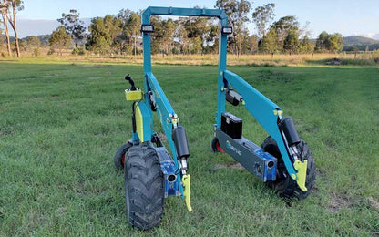 Electric skid steer working in a shed
