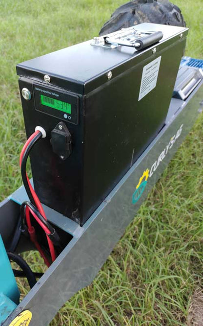 Electric farm hand loader in a paddock