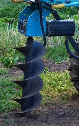Electric post hole auger digging to 900mm depth