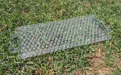 Dibble board marking consistent seedling spacing in a bed