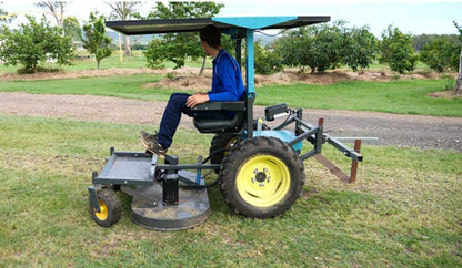 Mower deck mounted to the electric two-wheel tractor