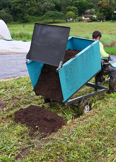 Tipping trailer tipping a load of soil